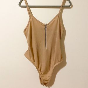 tan body suit